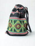 Borsa Sacco Etnica in Tessuto Kilim – Motivi Folk Intrecciati a Mano | Verde, Rosso, Nero con Frange